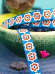 Zeige Details für 1m Webband Design Lila-Lotta - 12mm breit, Anemona Boom, blau Bild von 1m Webband Design Lila-Lotta - 12mm breit, Anemona Boom, blau