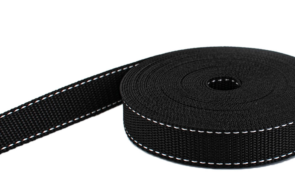 Bild von 10m PP Gurtband - 25mm breit - 1,4mm stark - schwarz mit weißem Faden (UV)